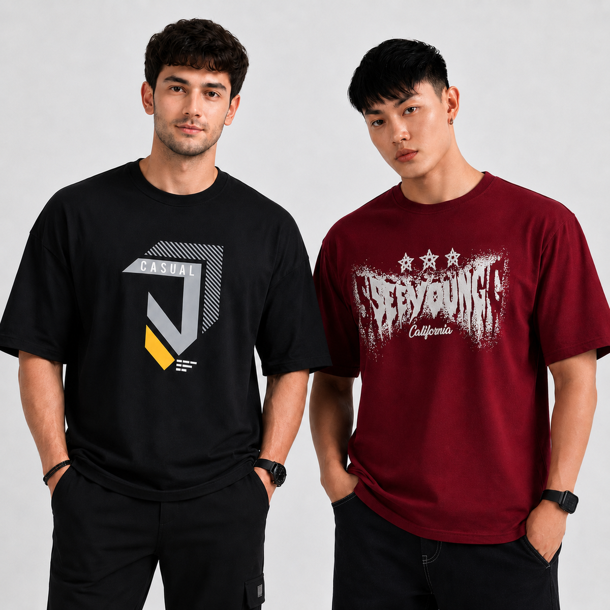 Two men modeling graphic t-shirts against a light gray studio background. The man on the left wears a black t-shirt with a gray and yellow geometric logo.